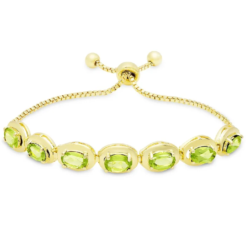 women gemstone bangles -Dolce Giavonna Gold Overlay Peridot Oval Adjustable Slider Bracelet