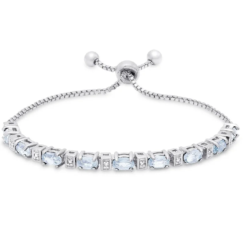 women luxury gold bracelets -Dolce Giavonna Sterling Silver Blue Topaz and Diamond Accent Oval Adjustable Slider Bracelet